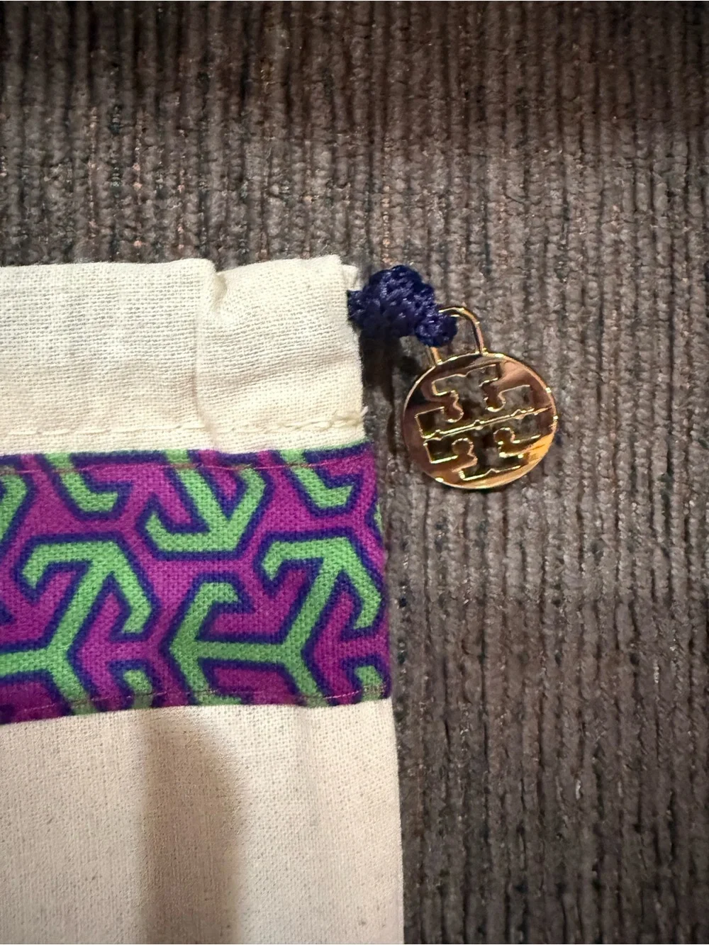 Tory Burch drawstring dust bag in a cream color 15 1/2” x 13 3/4”